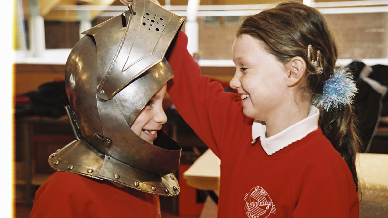 Children trying on armour