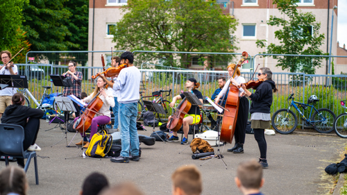 A band plays outdoors in Drumchapel.