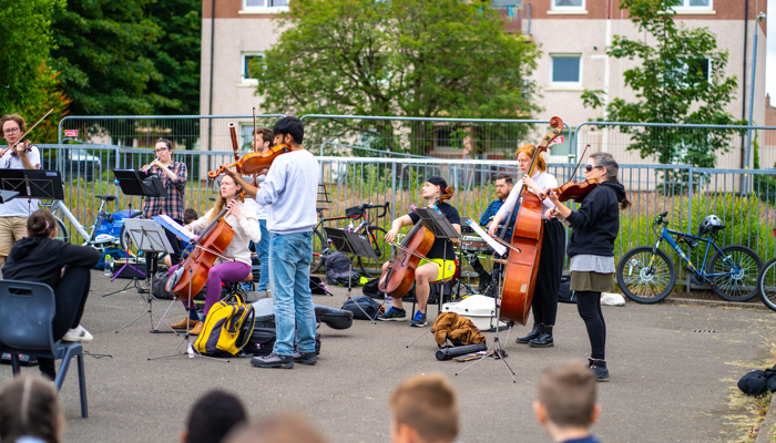 A band plays outdoors in Drumchapel.