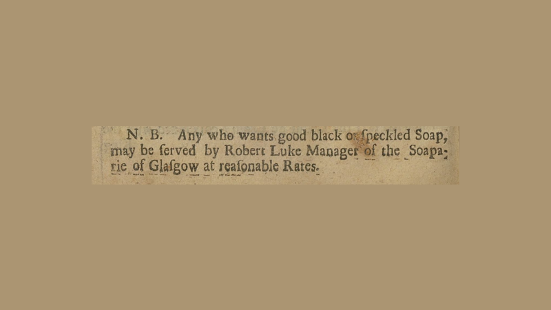 Clip of a newspaper from 1716. It reads: "N.B. Any who wants good black of speckled Soap, may be served by Robert Luke Manager of the Soaparie of Glasgow at reasonable rates.