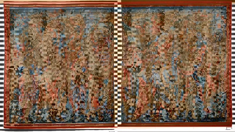 large colourful tapestry showing dozens of people and animals tightly packed into the piece