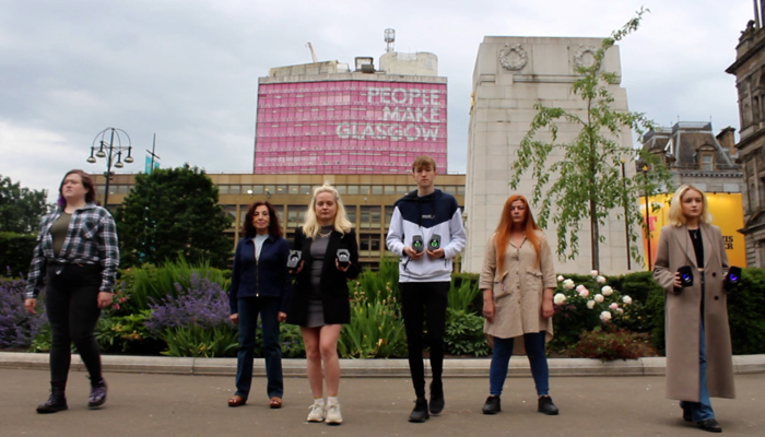 A group of young people standing in George Square
