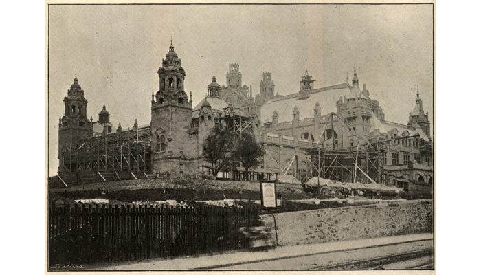 black and white image of the frontage of Kelvingrove Art Gallery and Museum - the front of which is supported by scaffolding bars.