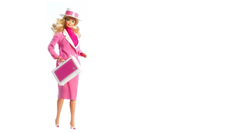 Barbie doll in a bright pink business suit with a fitted jacket, pencil skirt, white blouse, matching hat, and a pink briefcase. 