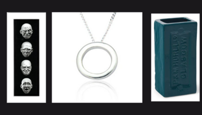 collage image with a print of 4 floating heads, a silver pendant necklace and a ceramic dark blue rectangle vase in a the shape of a house brick.