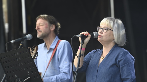 Two people sing on stage as part of UCI festivities. 