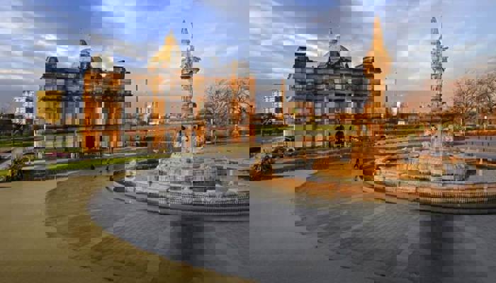 Peoples palace and fountain set against a blue winter sky