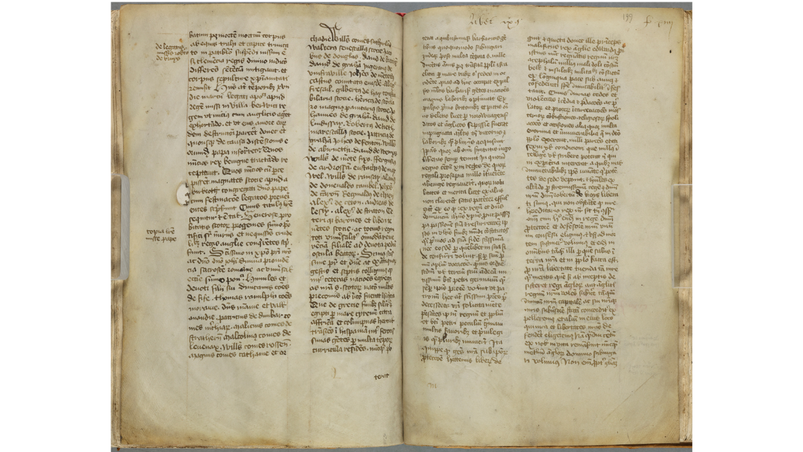 An open two-page spread of a medieval manuscript handwritten in Latin script, featuring two columns of text per page with small marginal annotations.