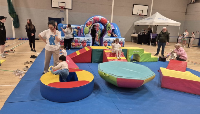 Young children playing on inflatables.