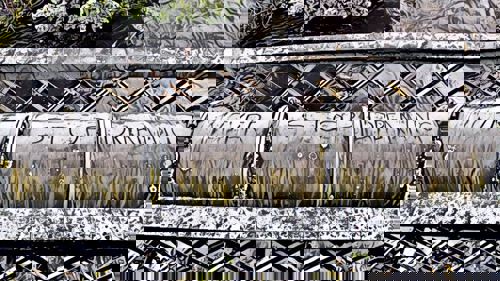 An image of artist work. It shows a large pipe with the words never stop dreaming.